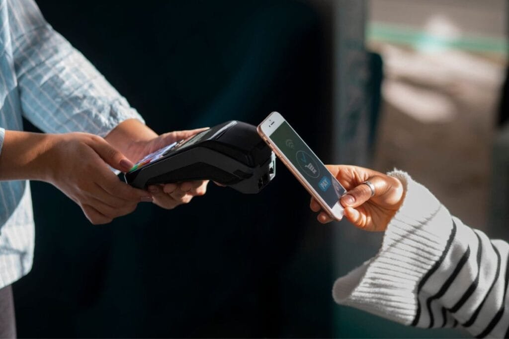 Person Paying with Apple Pay Person Paying With Apple Pay
