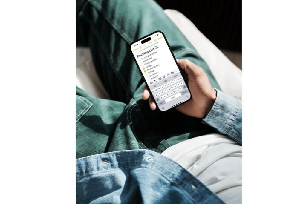 Use Notes App iPhone Tips for Travel showing someone using the notes app for a packing list.