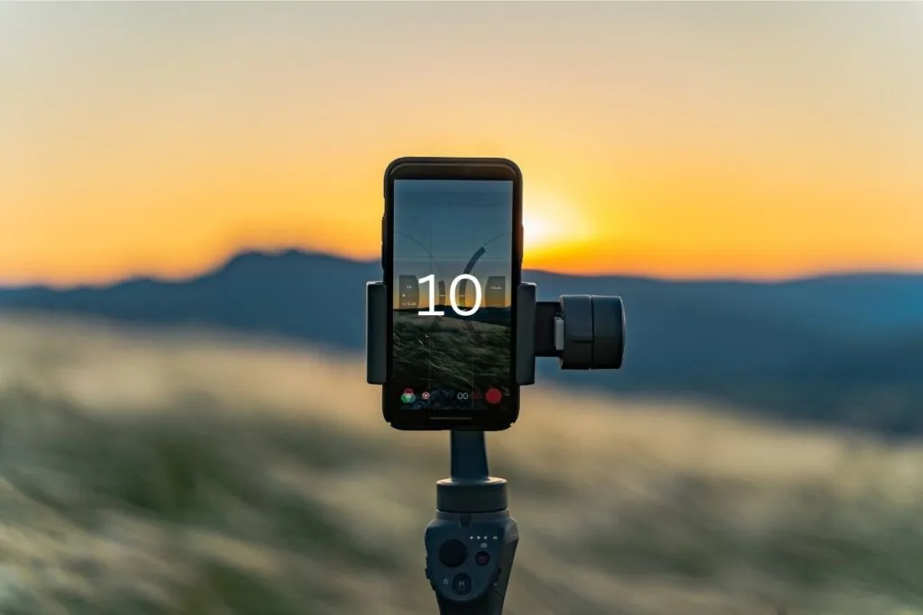 iPhone on a tripod using the timer taking photo of sunset as an example of how to take a good photo on iPhone using the timer.