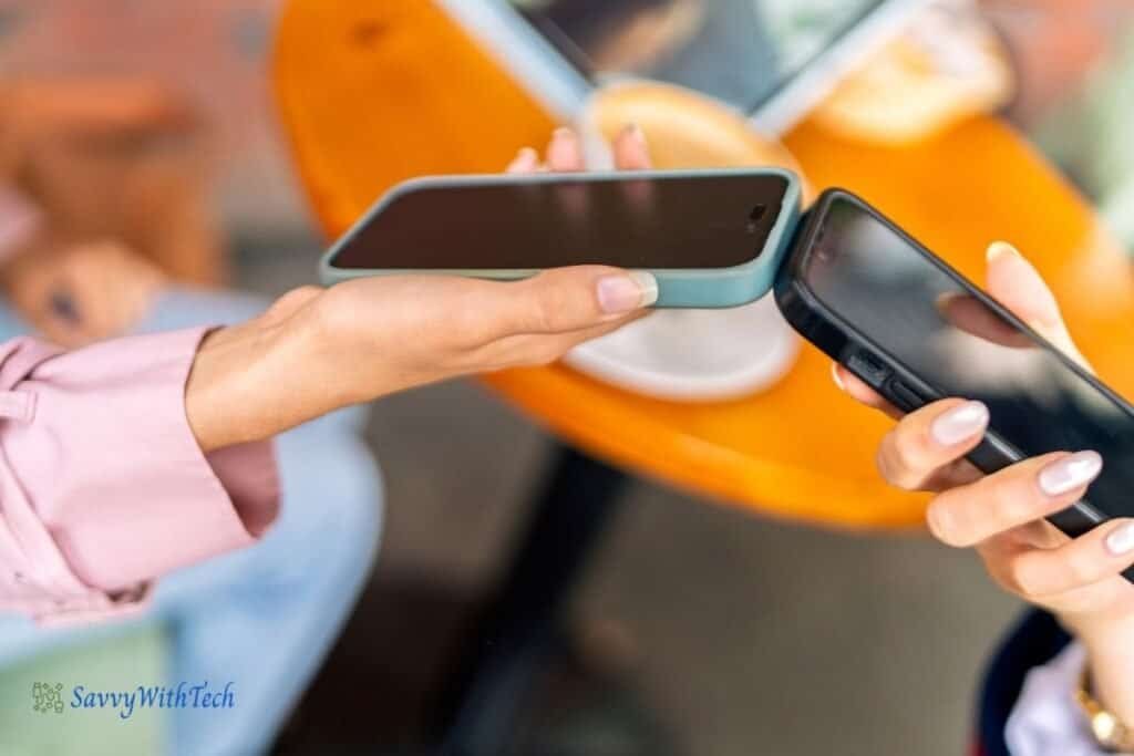 Two iPhones being held together as an example of Brining Devices Together option on iPhone.