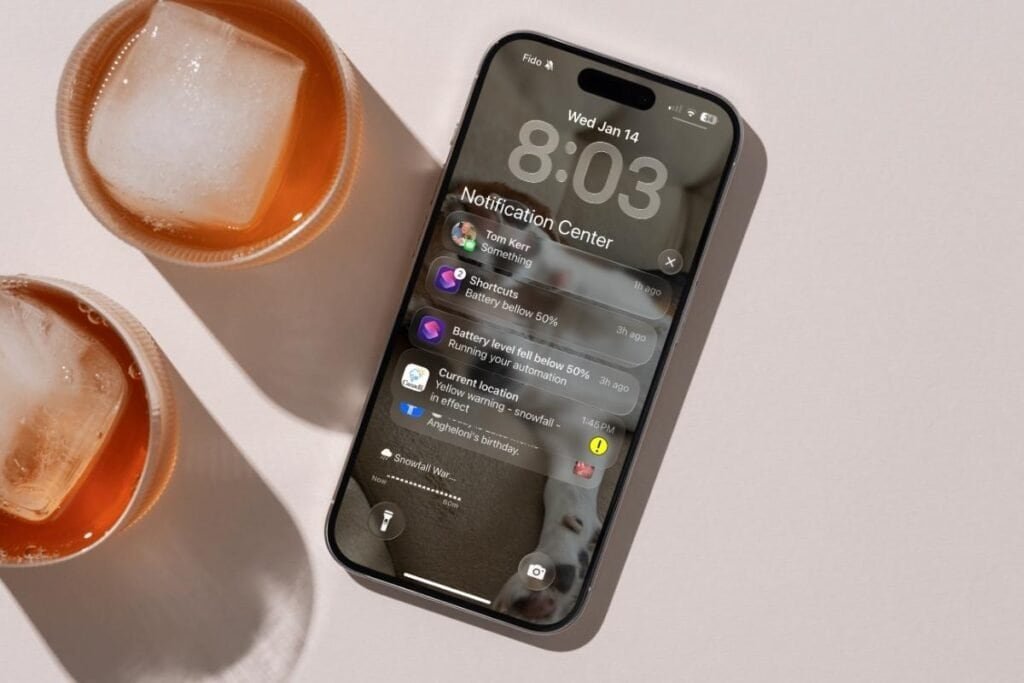 iPhone Battery draining by notifications iPhone screen notification screen sitting on a table next to two drinks. This is an example of how iPhone battery draining by notifications